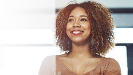 woman smiling looking out